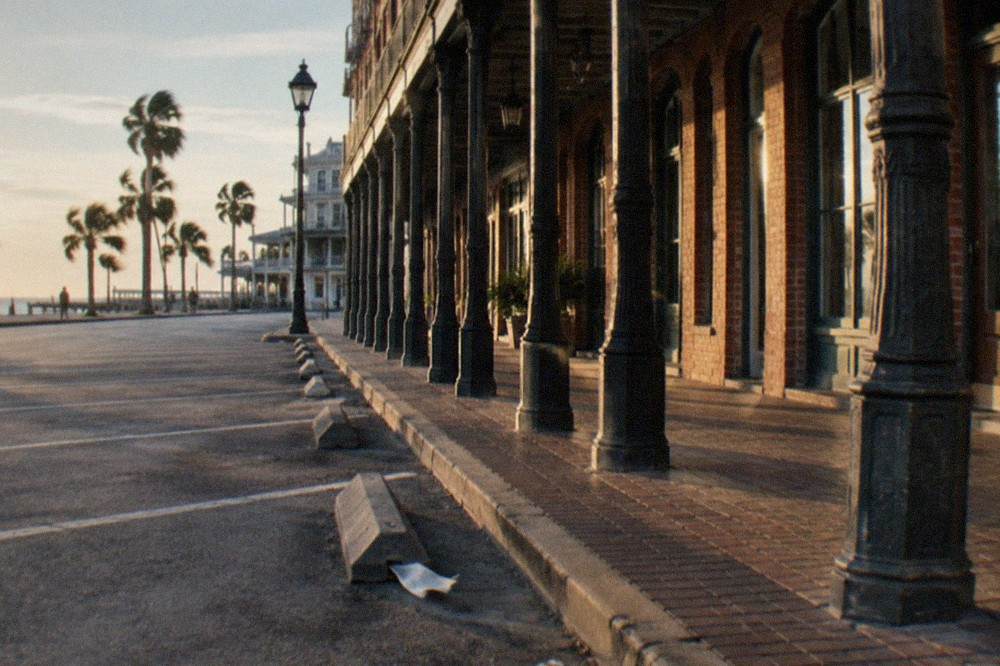 Empty Strand street parking spaces in late afternoon light